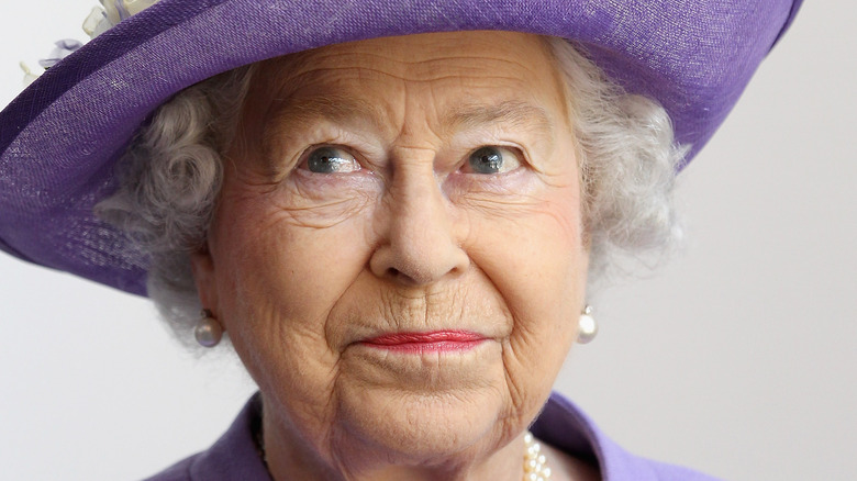 Queen Elizabeth in purple hat