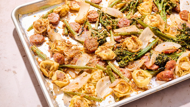 roasted tortellini and vegetables on sheet tray