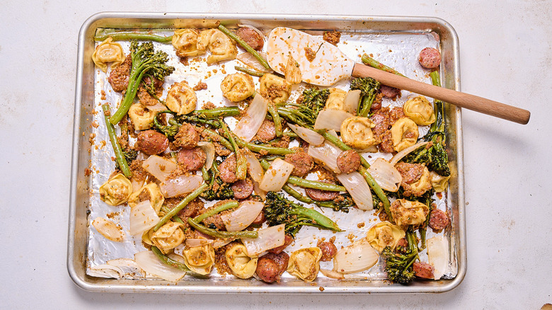 pasta and sausage tossed with red pesto