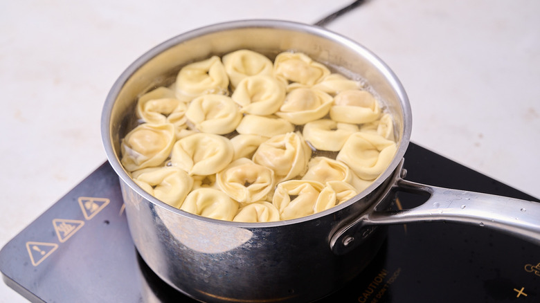 boiling tortellini in a pot