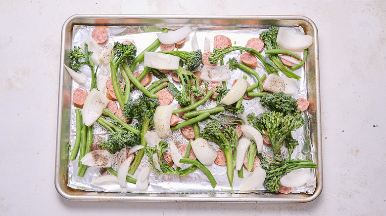 sausage and vegetables coated in seasonings