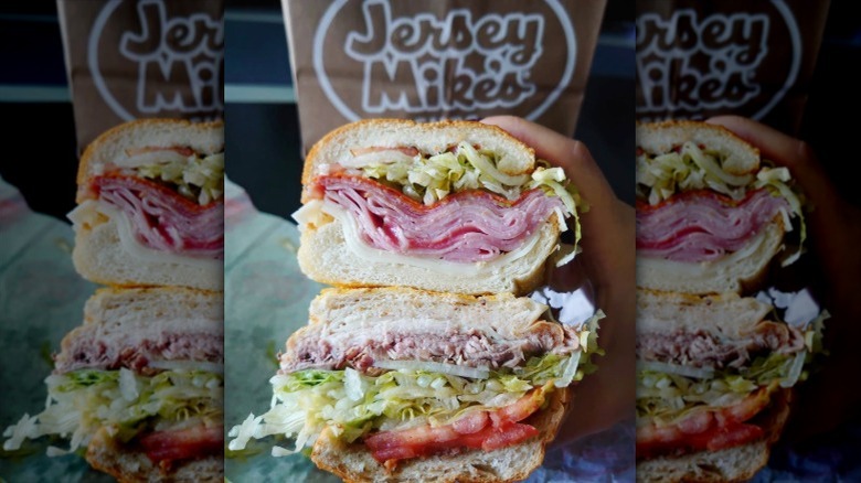 hand holding Jersey Mike's sub