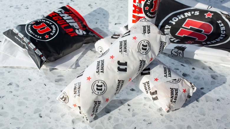 Two wrapped Jimmy John's sandwiches