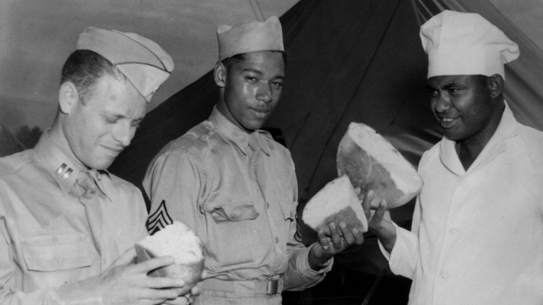 American soldiers breaking bread WW2