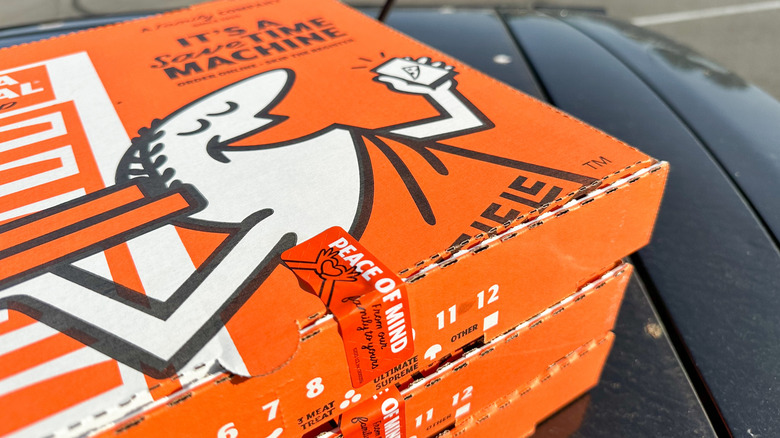 boxes of Little Caesars pizza