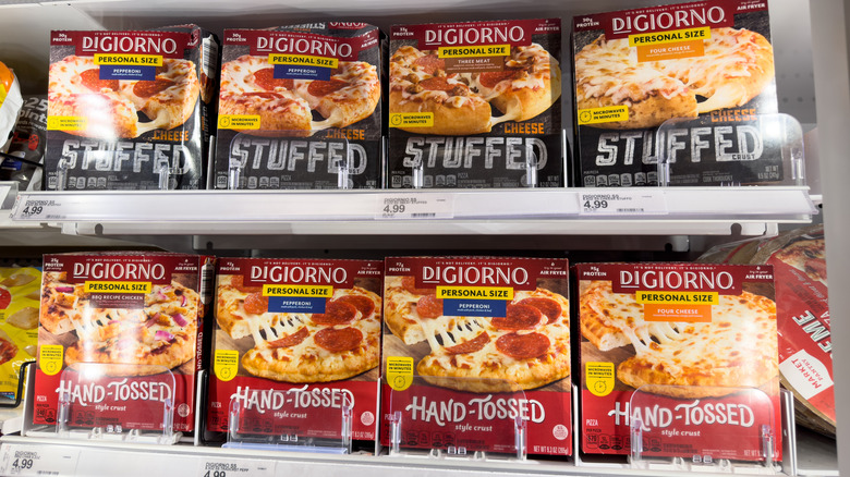 A variety of DiGiorno pizza boxed in the freezer section