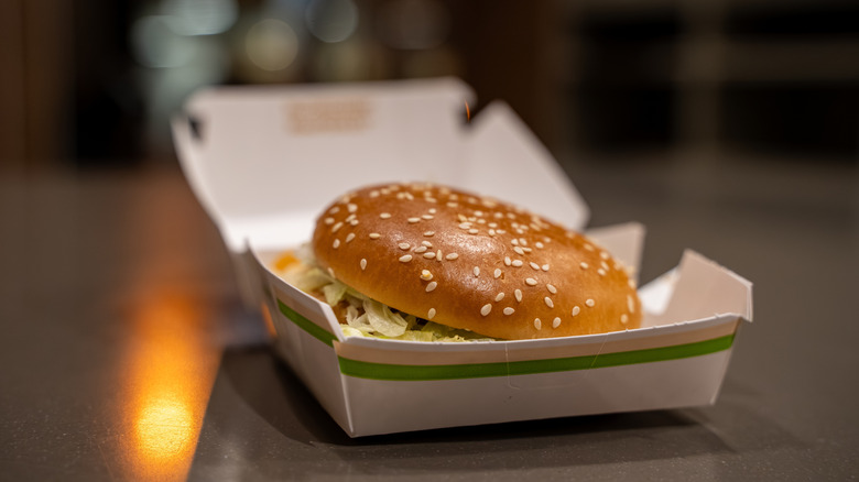 McDonald's hamburger in open takeaway box