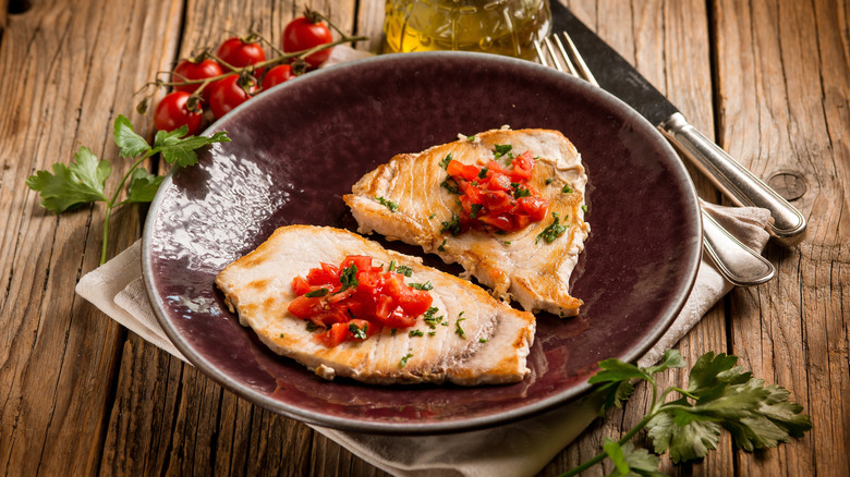 Grilled swordfish and tomatoes