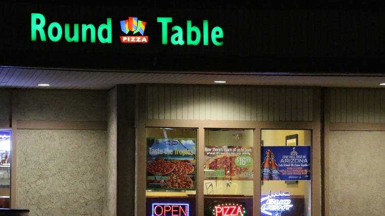 exterior shot of a round table pizza