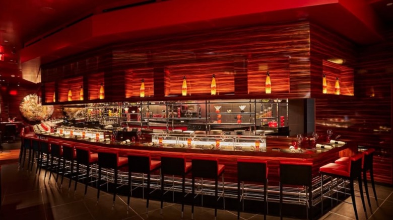 An image of the bar and open kitchen at L'Atelier de Joël Robuchon in Miami