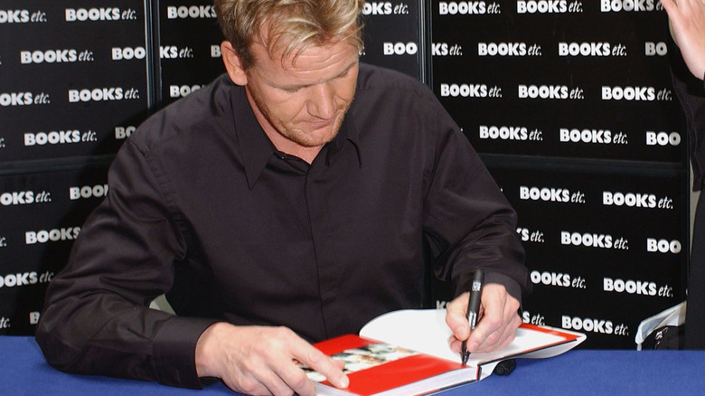 Gordon Ramsay signing a book