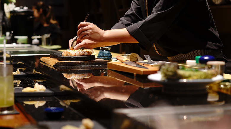 Japanese chef making food at restaurant