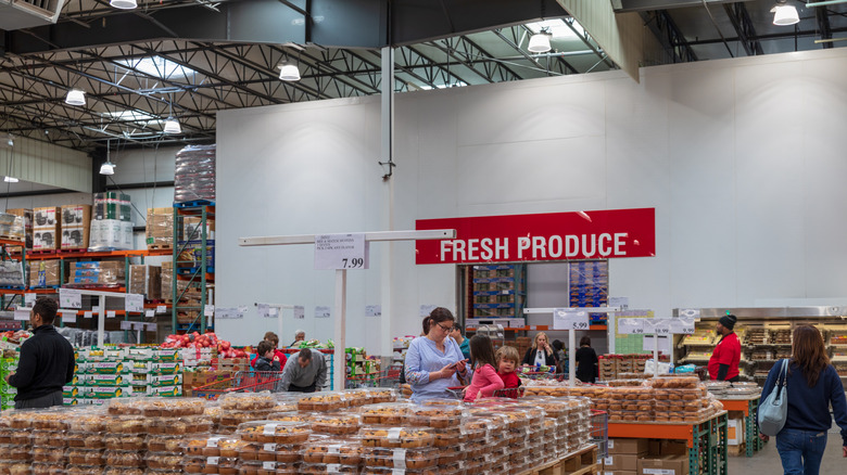 People shopping in the produce section of Costco