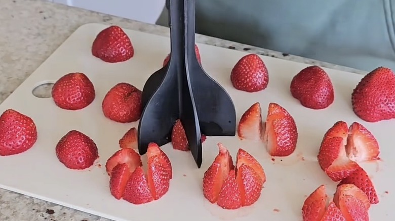A meat chopper used to cut strawberries