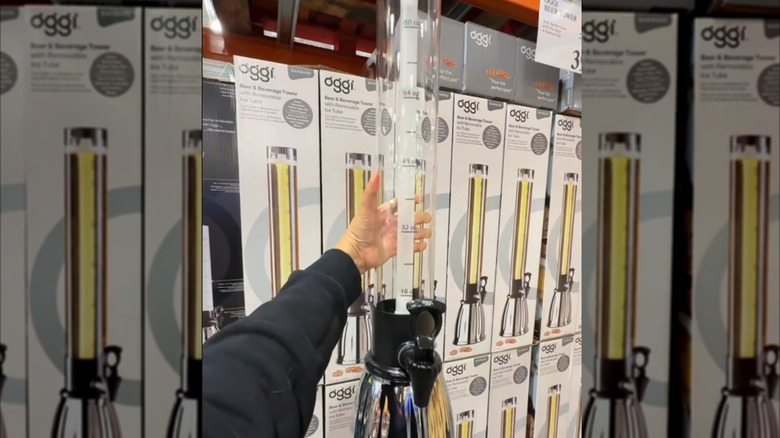 Someone holds the Oggi Beer Tower at Costco