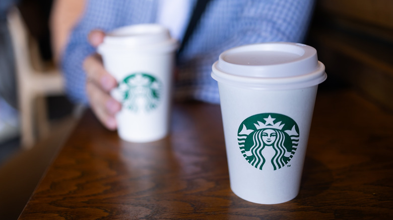 starbucks cups on wood table