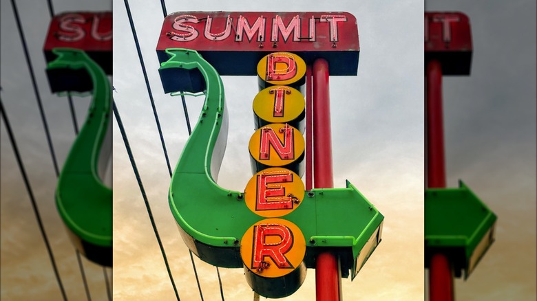 The road sign of Summit Diner in a bright neon, retro style