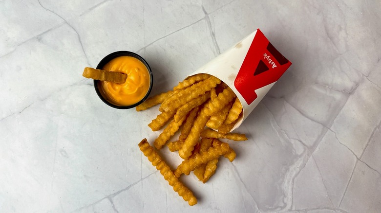 Arby's cheddar cheese sauce with crinkle-cut fries