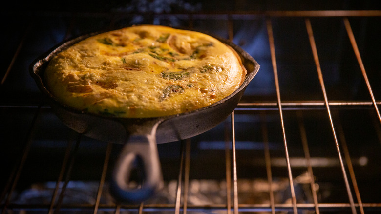 Frittata in cast iron pan in oven