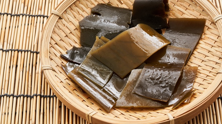 Soaked kombu sheets bamboo surfaces