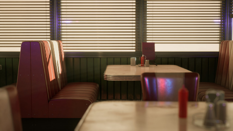 View of tables and booths inside a diner restaurant