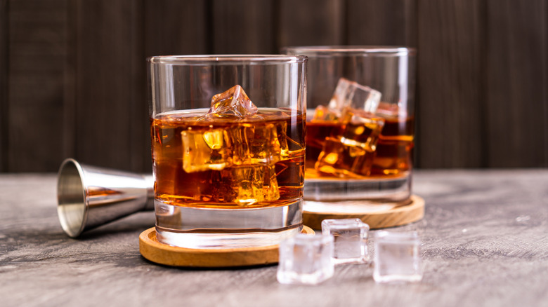 two bourbon cocktails in glasses