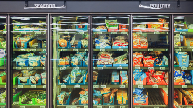 freezers inside of Aldi store filled with frozen seafood and poultry items