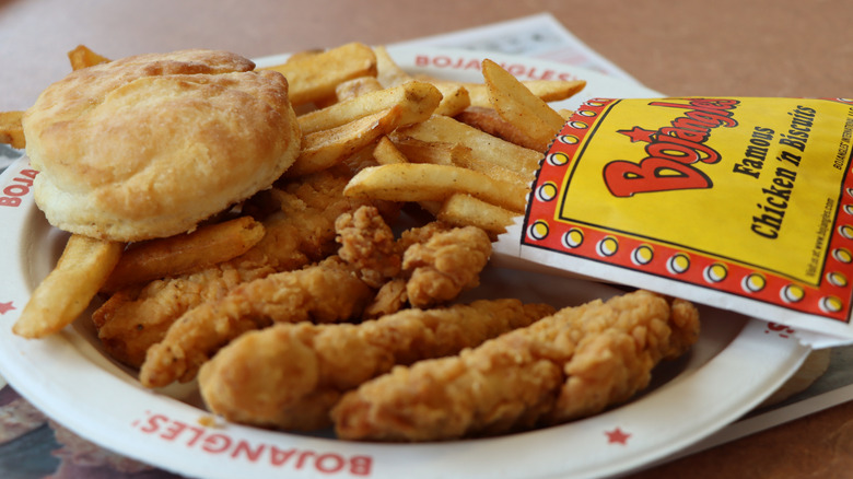 Plate of Bojangles chicken tenders, fries, and a biscuit