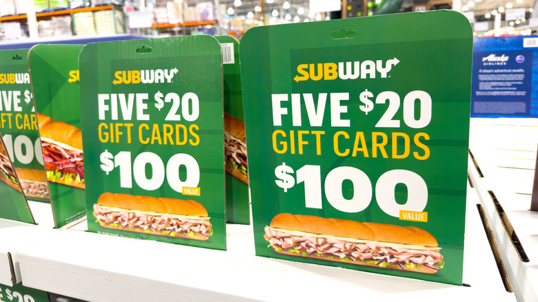 Green promo signs for Subway gift cards at Costco