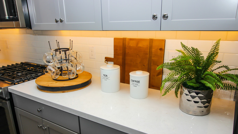 Lazy Susan with mugs on kitchen counter
