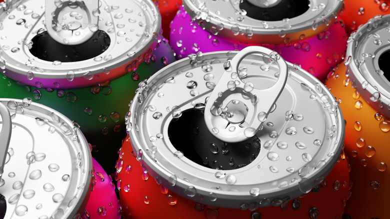 Closeup of soda cans opened up