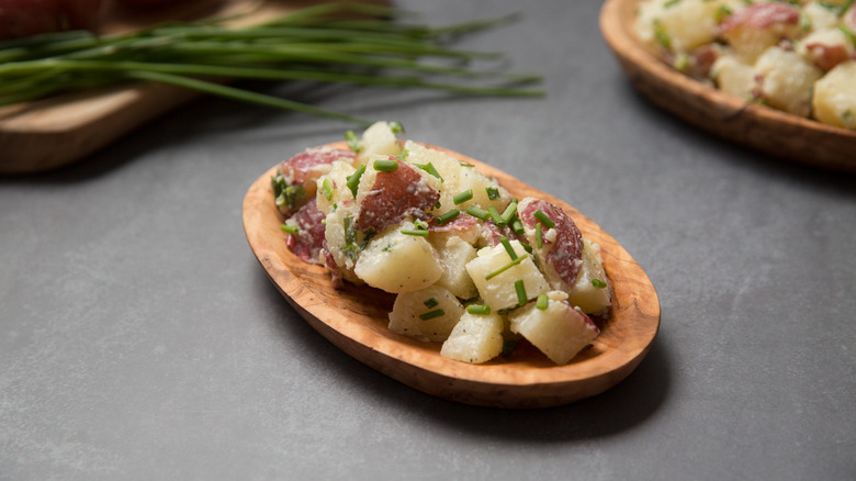 potato salad in wooden dish