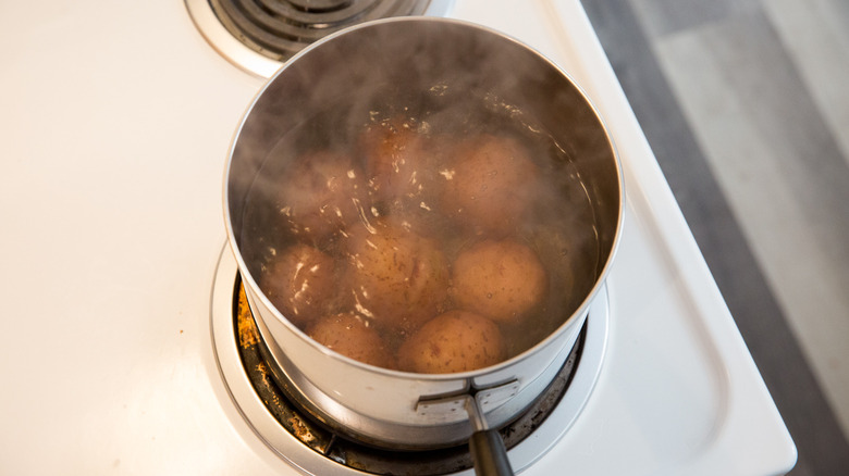 red potatoes boiling in pot