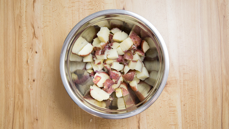 chopped potatoes in mixing bowl