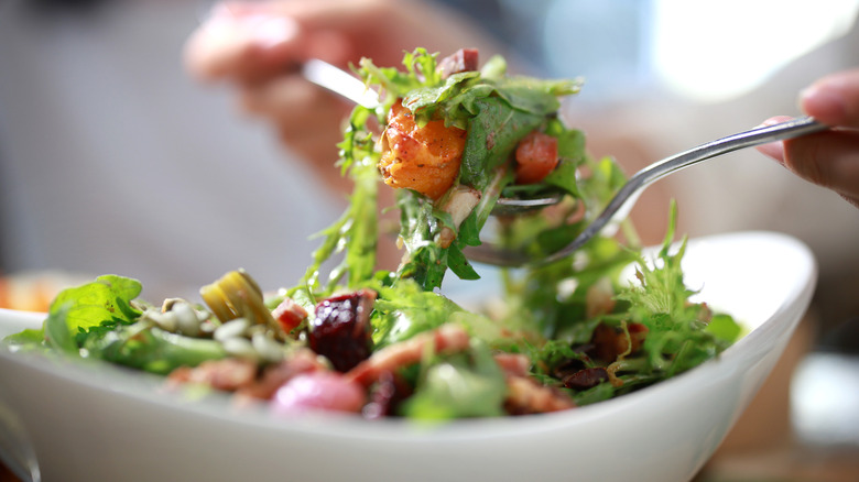 tossing unspecified salad