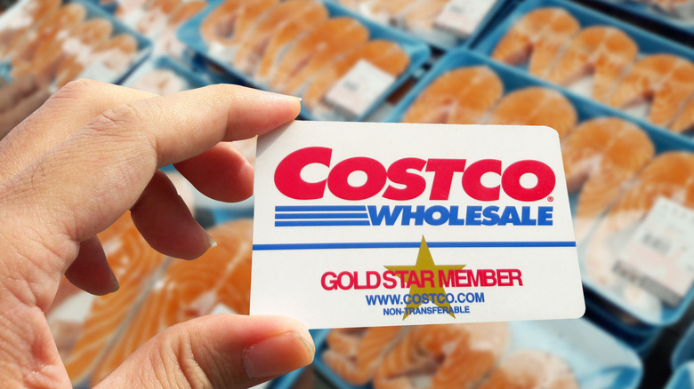 Costco card with seafood in the background.