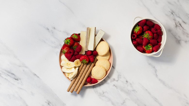 Cookies and berries on plate