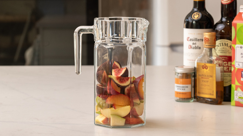 chopped fruit in a pitcher