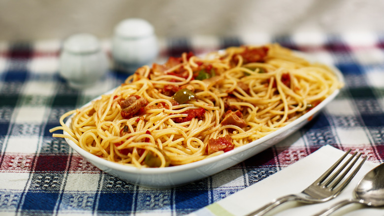 spaghetti dish on checkered tablecloth