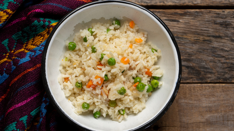 fluffy Mexican rice with diced carrots and peas