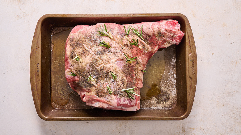 lamb scored with rosemary and garlic