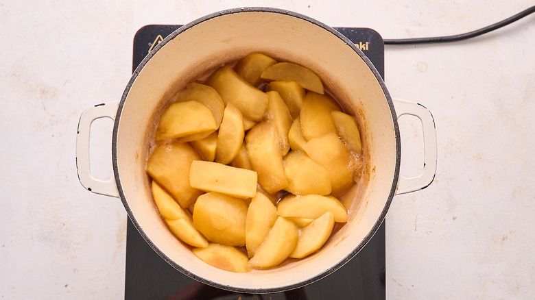softened apples in a pot