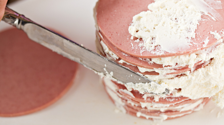 bologna cake being iced