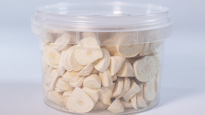 a container filled with freeze-dried garlic