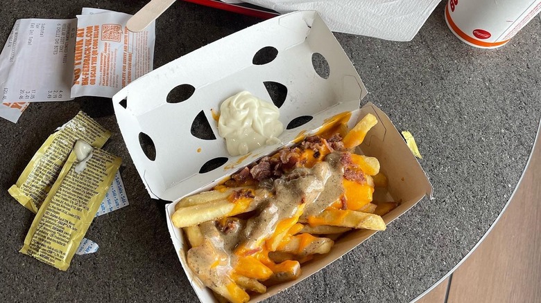 A container of loaded cheese fries from Burger King