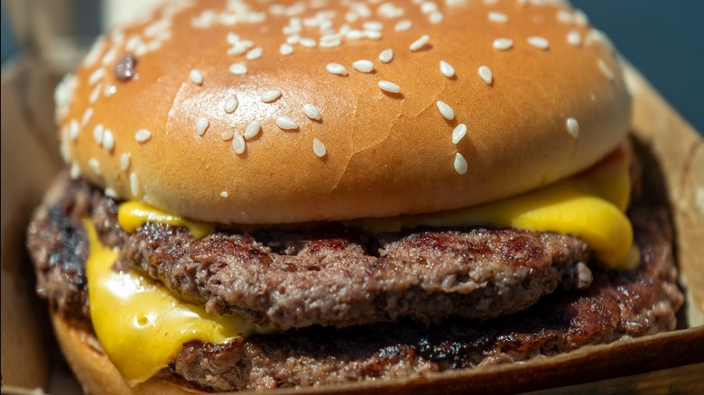 Double cheeseburger from McDonald's with a sesame seed bun and melty cheese on the patties