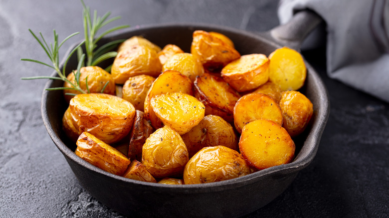 roasted potatoes in iron skillet