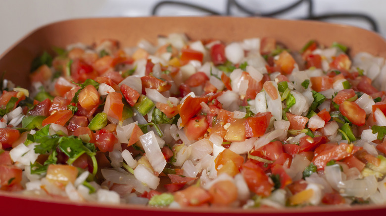 Pico de Gallo simmering in a pan.