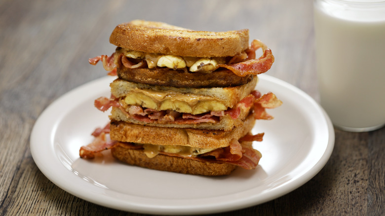 A stack of fried Elvis sandwiches, containing peanut butter, bacon, and banana