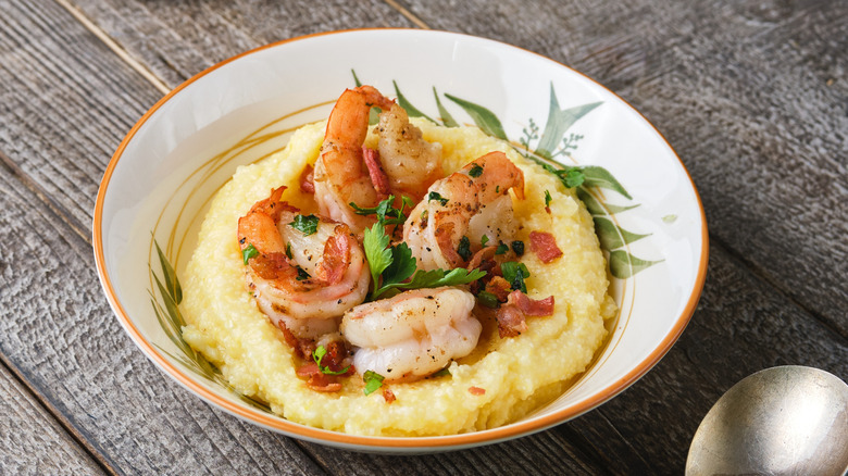 Shrimp and grits in white bowl